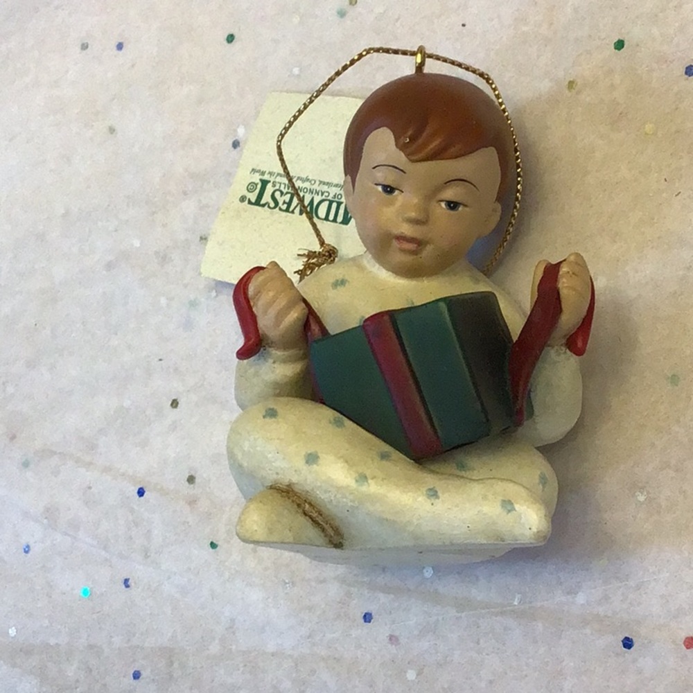 Midwest exclusive design boy opens first present , vintage